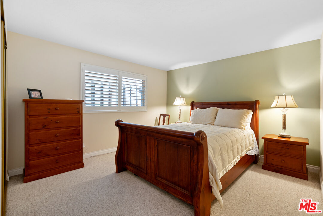 3941 Sunset Lane Oxnard, CA 93035 - Photo 14 of 24 a bedroom with a bed and a dresser
