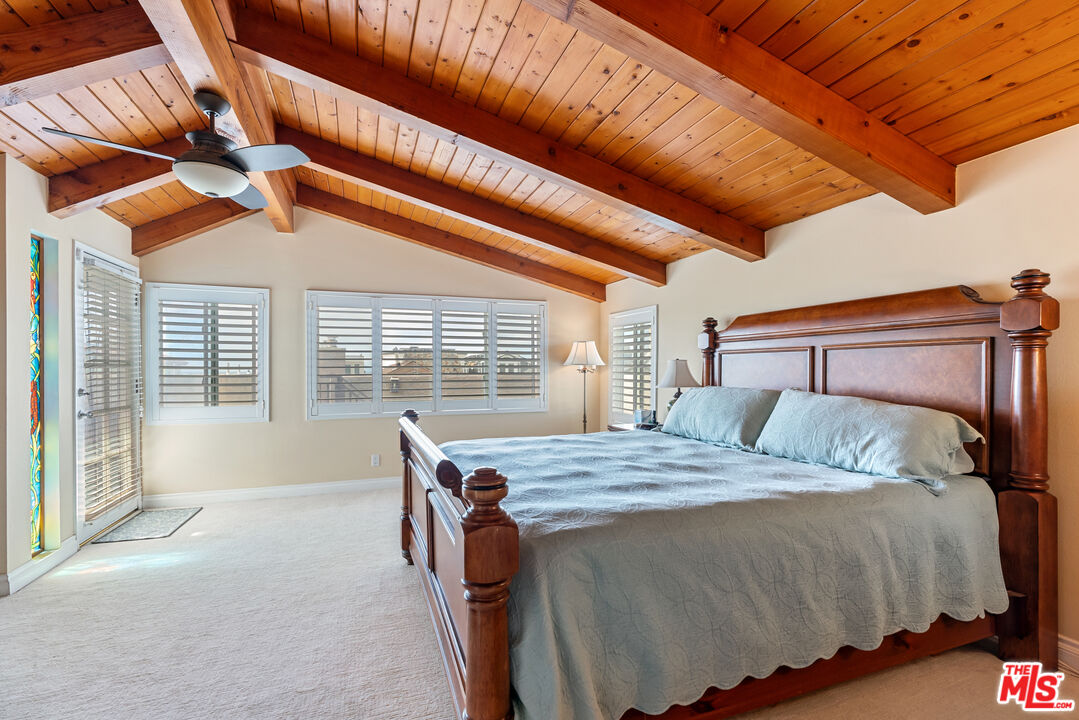 3941 Sunset Lane Oxnard, CA 93035 - Photo 10 of 24 a bedroom with a bed and a large window