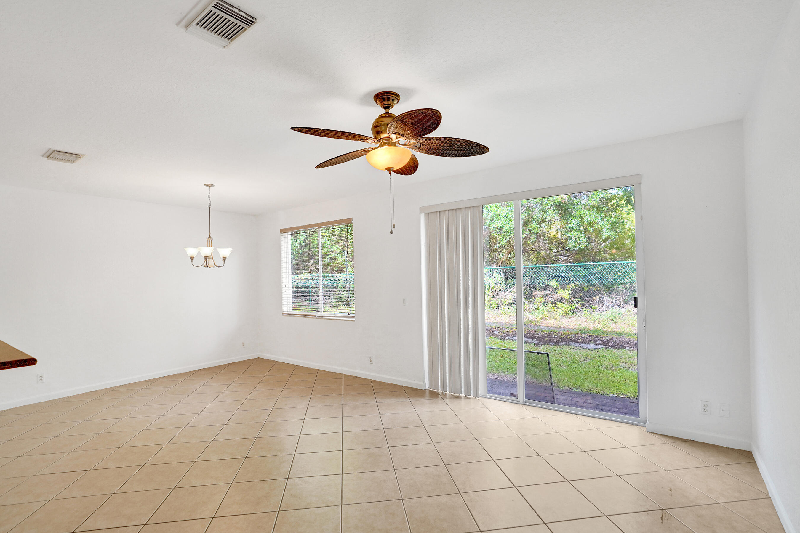 3072 North Evergreen Circle Boynton Beach, FL 33426 - Photo 13 of 55 a view of an empty room with a window