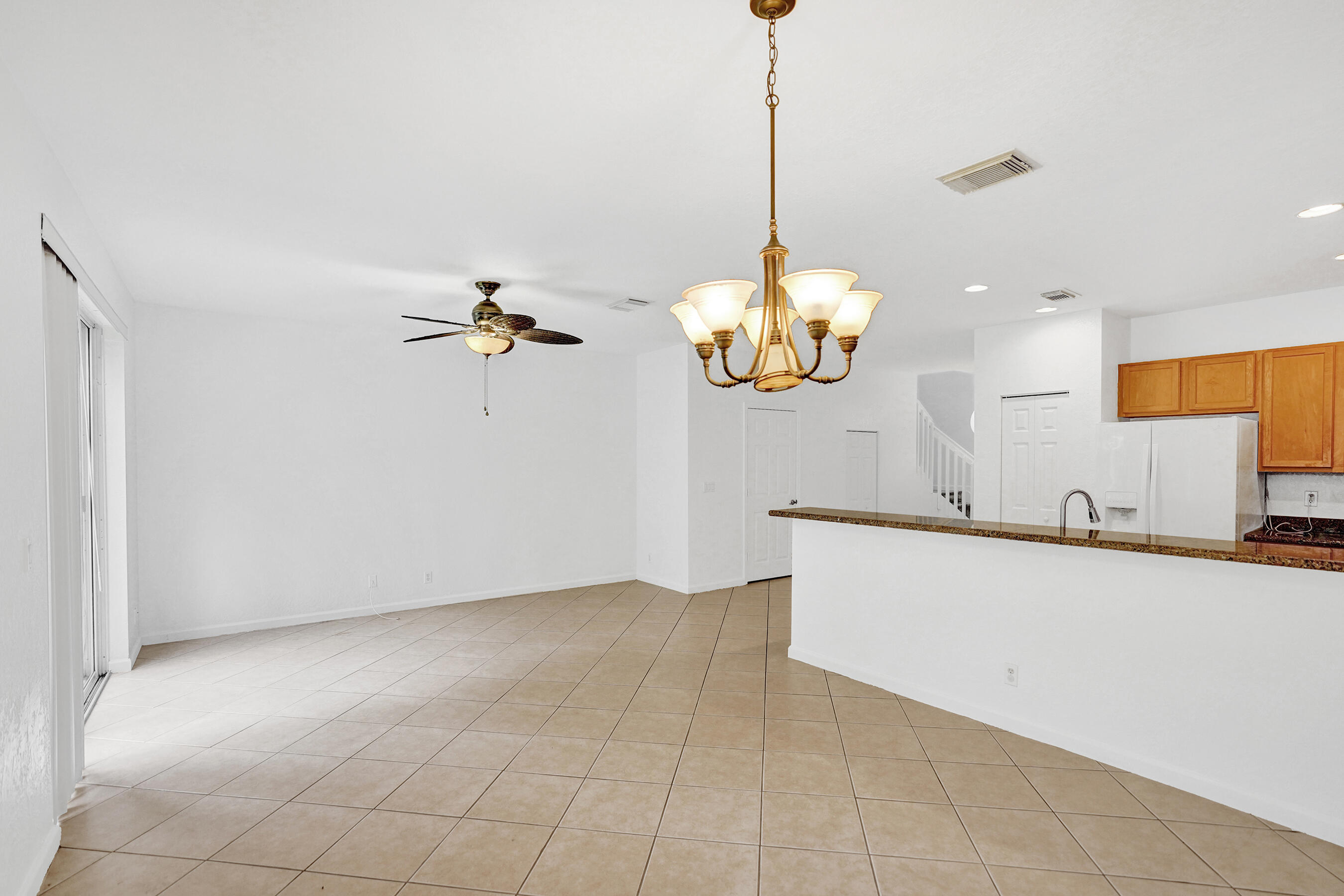 3072 North Evergreen Circle Boynton Beach, FL 33426 - Photo 18 of 55 a view of a kitchen with a chandelier