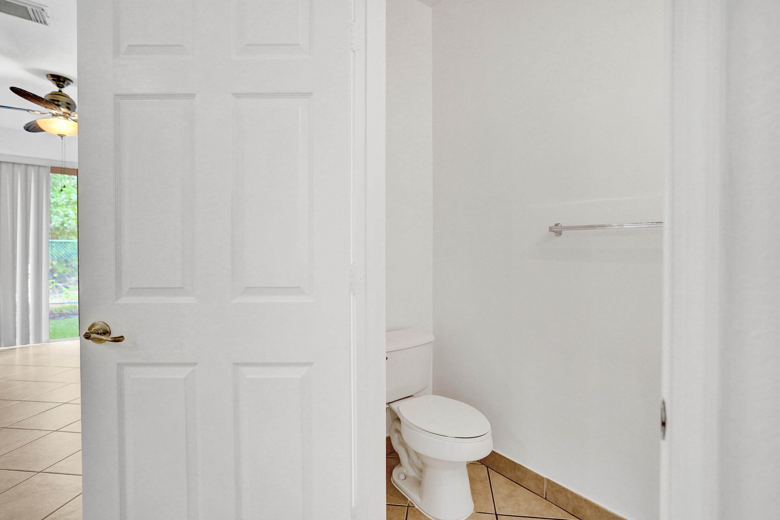 3072 North Evergreen Circle Boynton Beach, FL 33426 - Photo 21 of 55 a white toilet sitting next to a shower