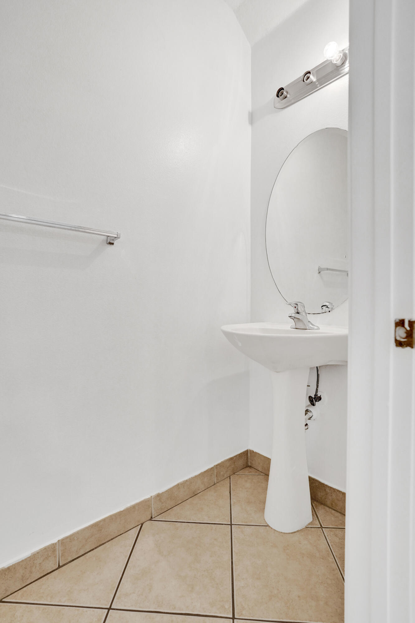 3072 North Evergreen Circle Boynton Beach, FL 33426 - Photo 23 of 55 a bathroom with a sink and mirror