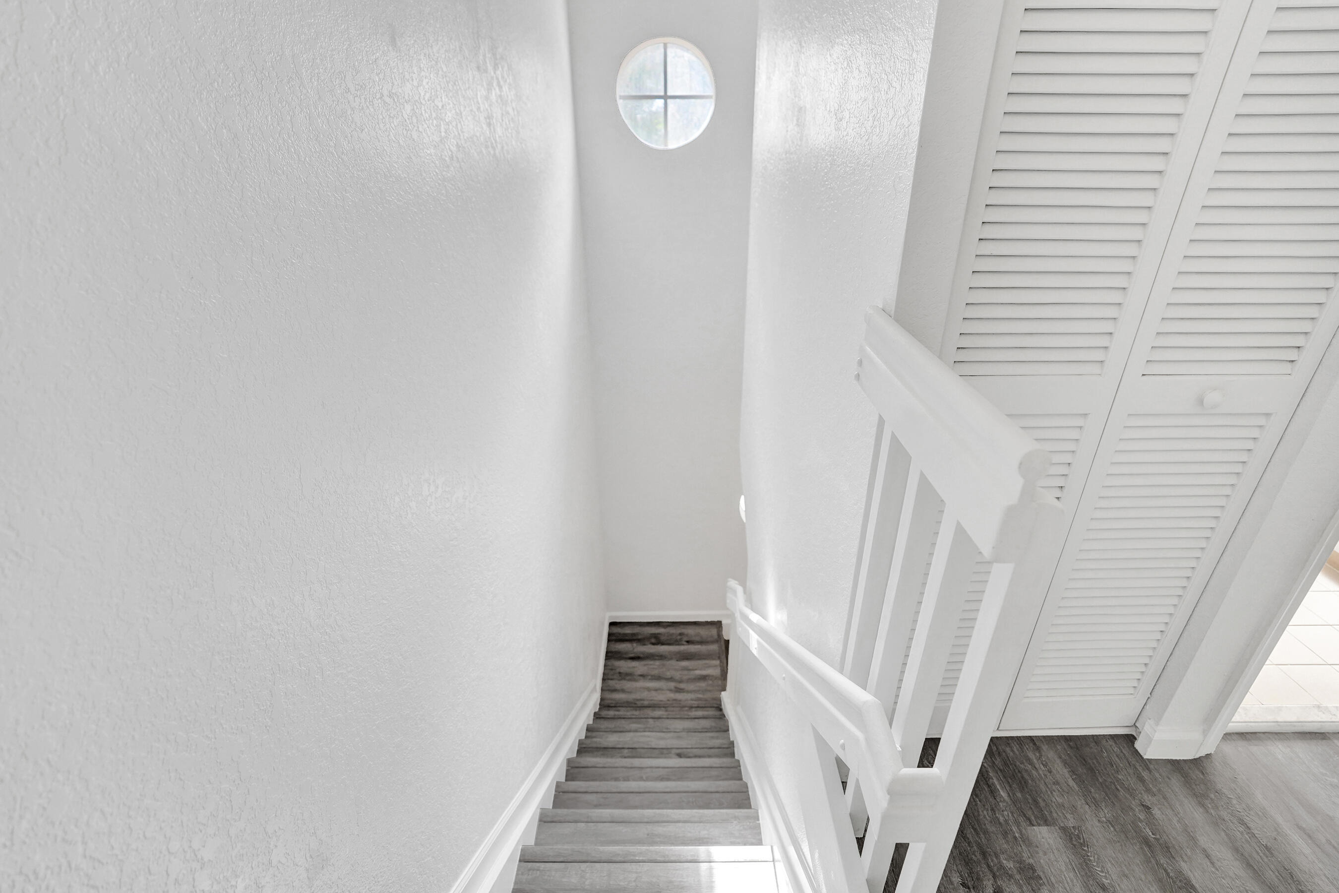 3072 North Evergreen Circle Boynton Beach, FL 33426 - Photo 27 of 55 a view of a hallway with wooden floor