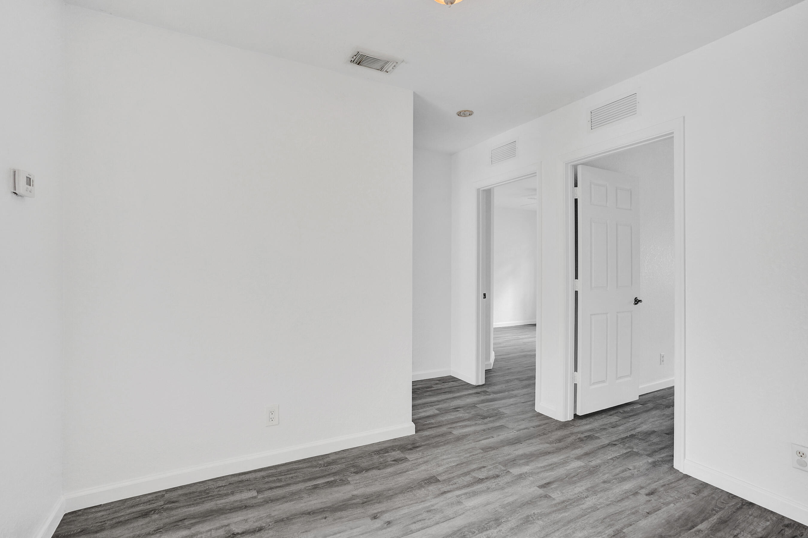 3072 North Evergreen Circle Boynton Beach, FL 33426 - Photo 29 of 55 a view of an empty room with wooden floor