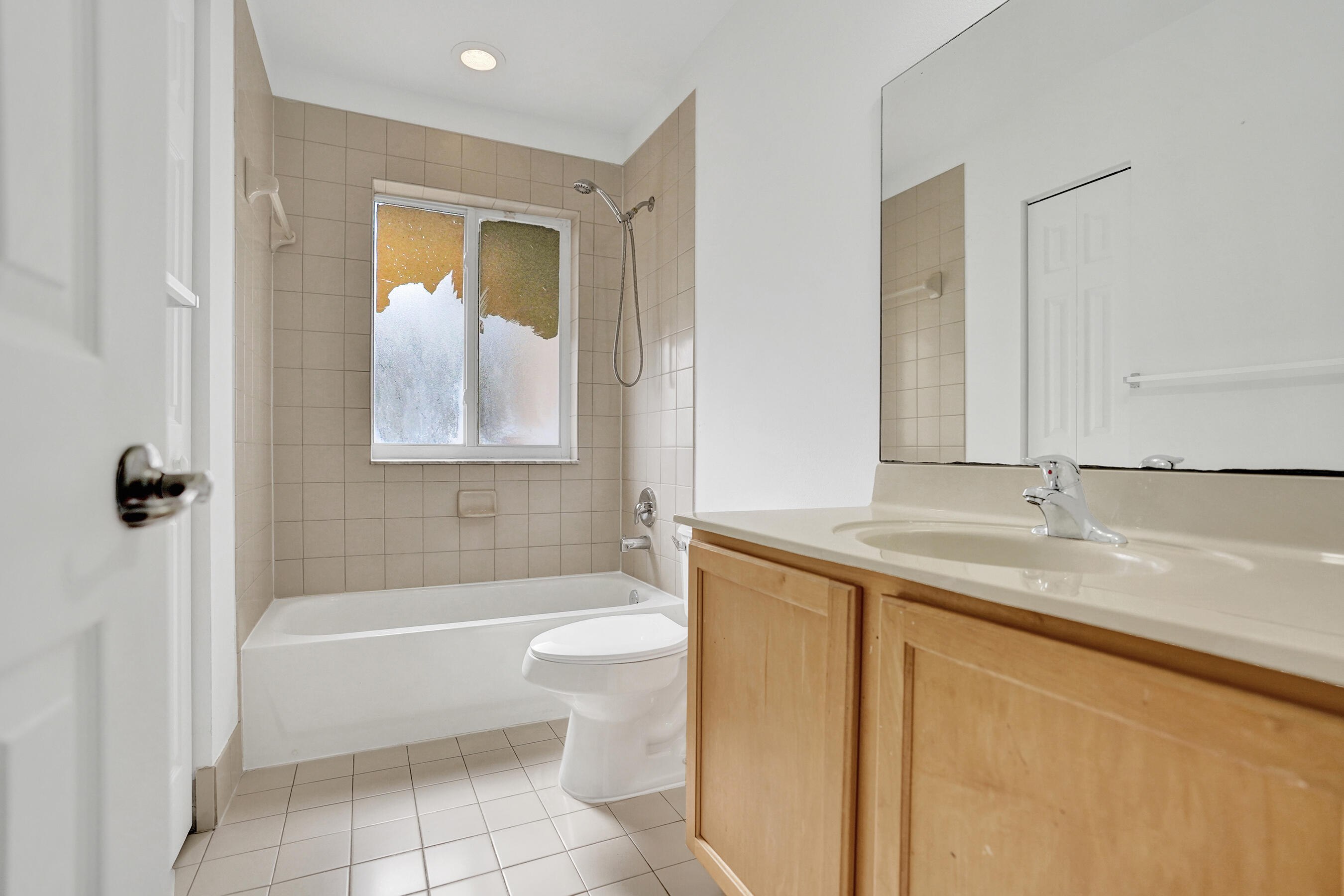 3072 North Evergreen Circle Boynton Beach, FL 33426 - Photo 30 of 55 a bathroom with a granite countertop sink a toilet and bathtub