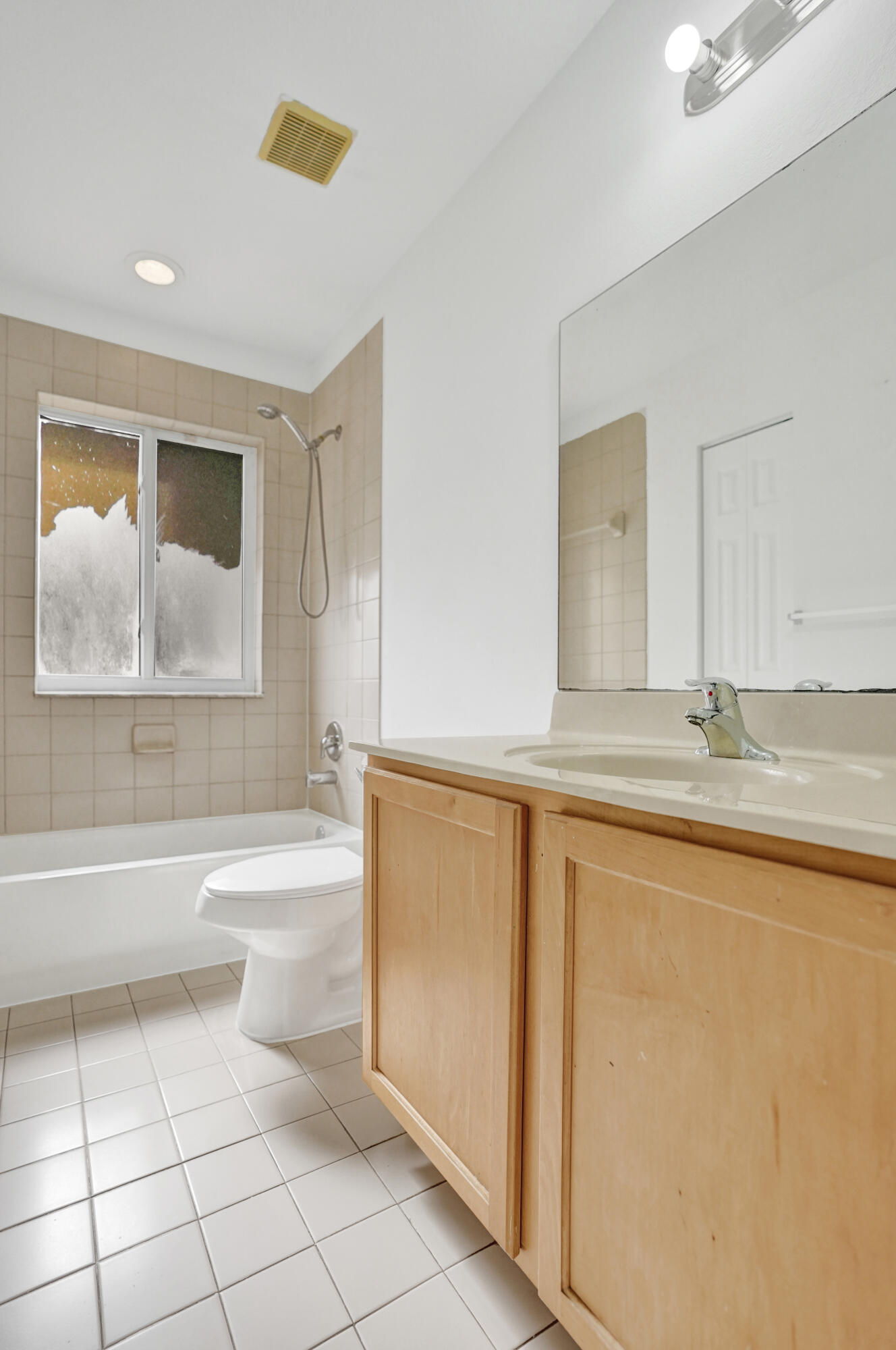 3072 North Evergreen Circle Boynton Beach, FL 33426 - Photo 31 of 55 a bathroom with a granite countertop sink a toilet a mirror and bathtub