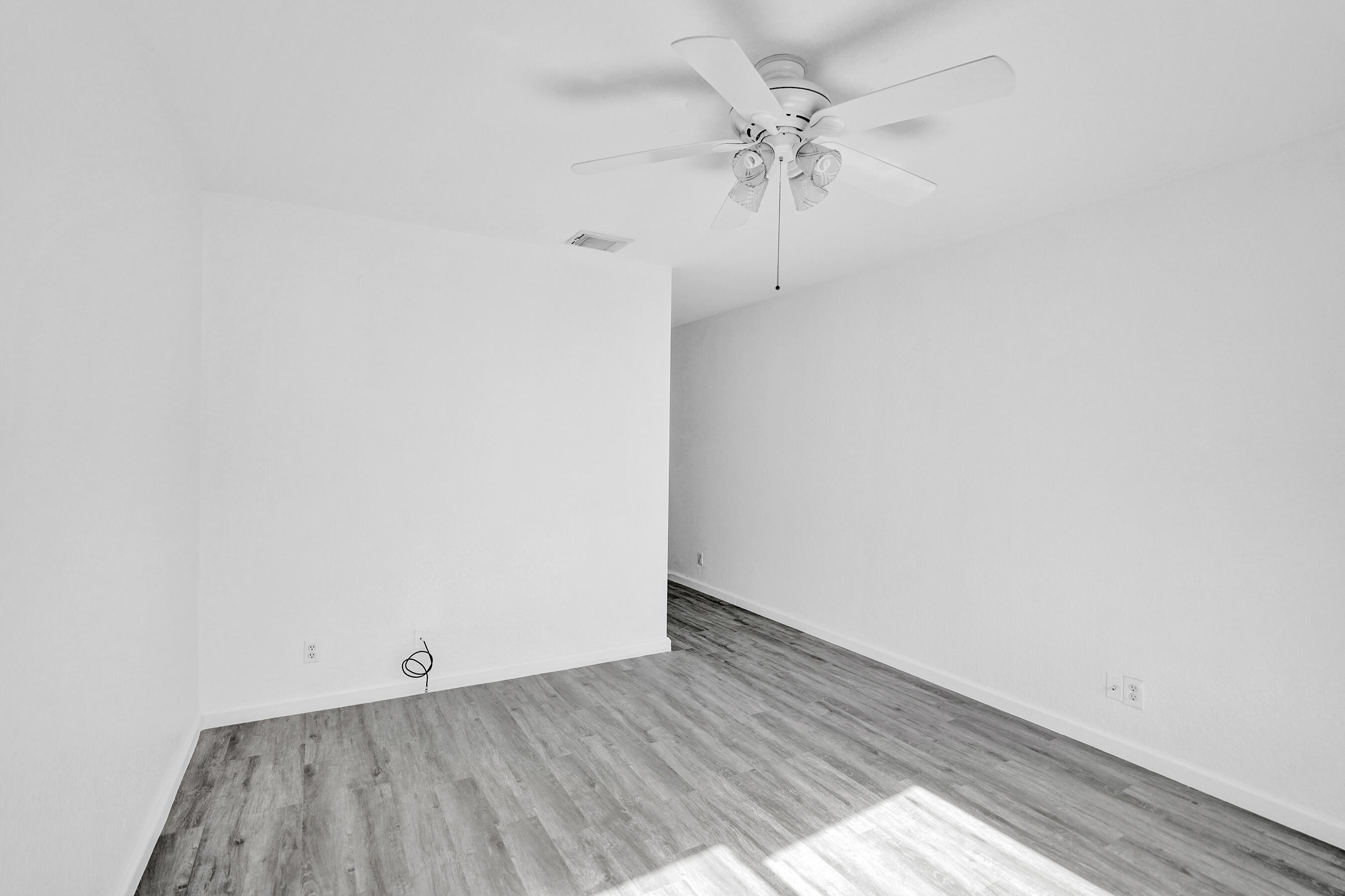 3072 North Evergreen Circle Boynton Beach, FL 33426 - Photo 47 of 55 an empty room with a fan and a window
