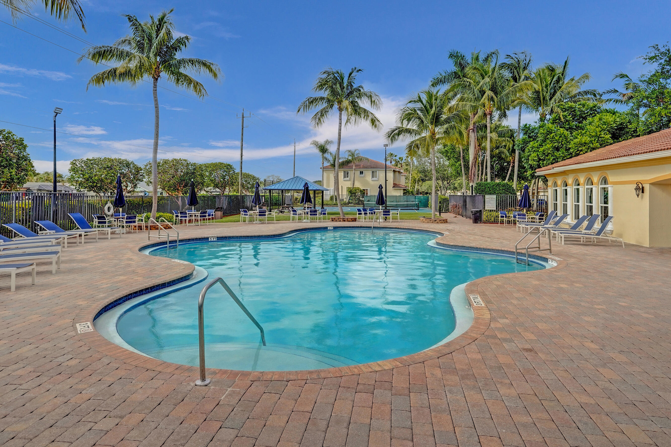 3072 North Evergreen Circle Boynton Beach, FL 33426 - Photo 50 of 55 a view of a swimming pool with a lounge chairs