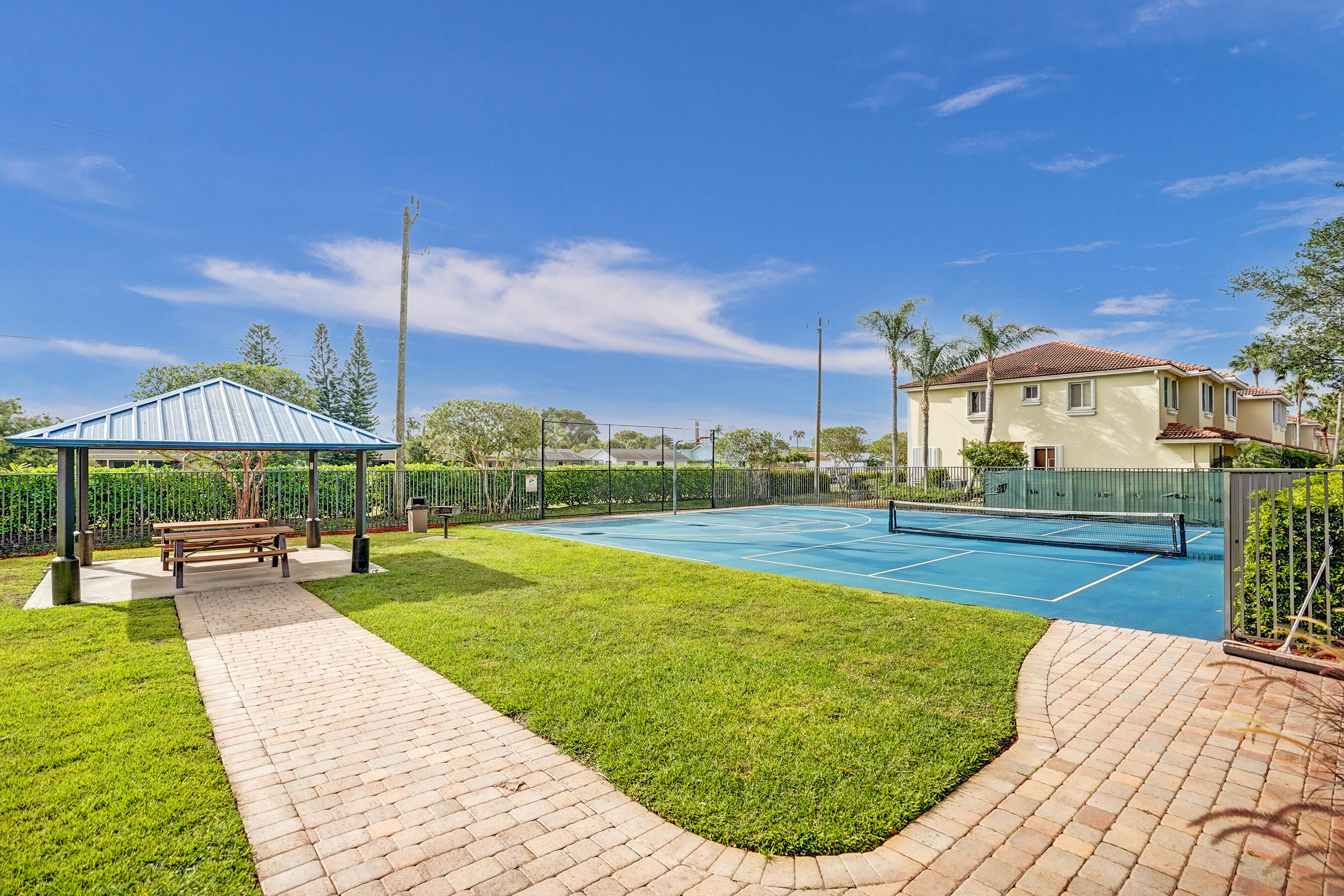 3072 North Evergreen Circle Boynton Beach, FL 33426 - Photo 53 of 55 a view of a house with swimming pool and sitting area