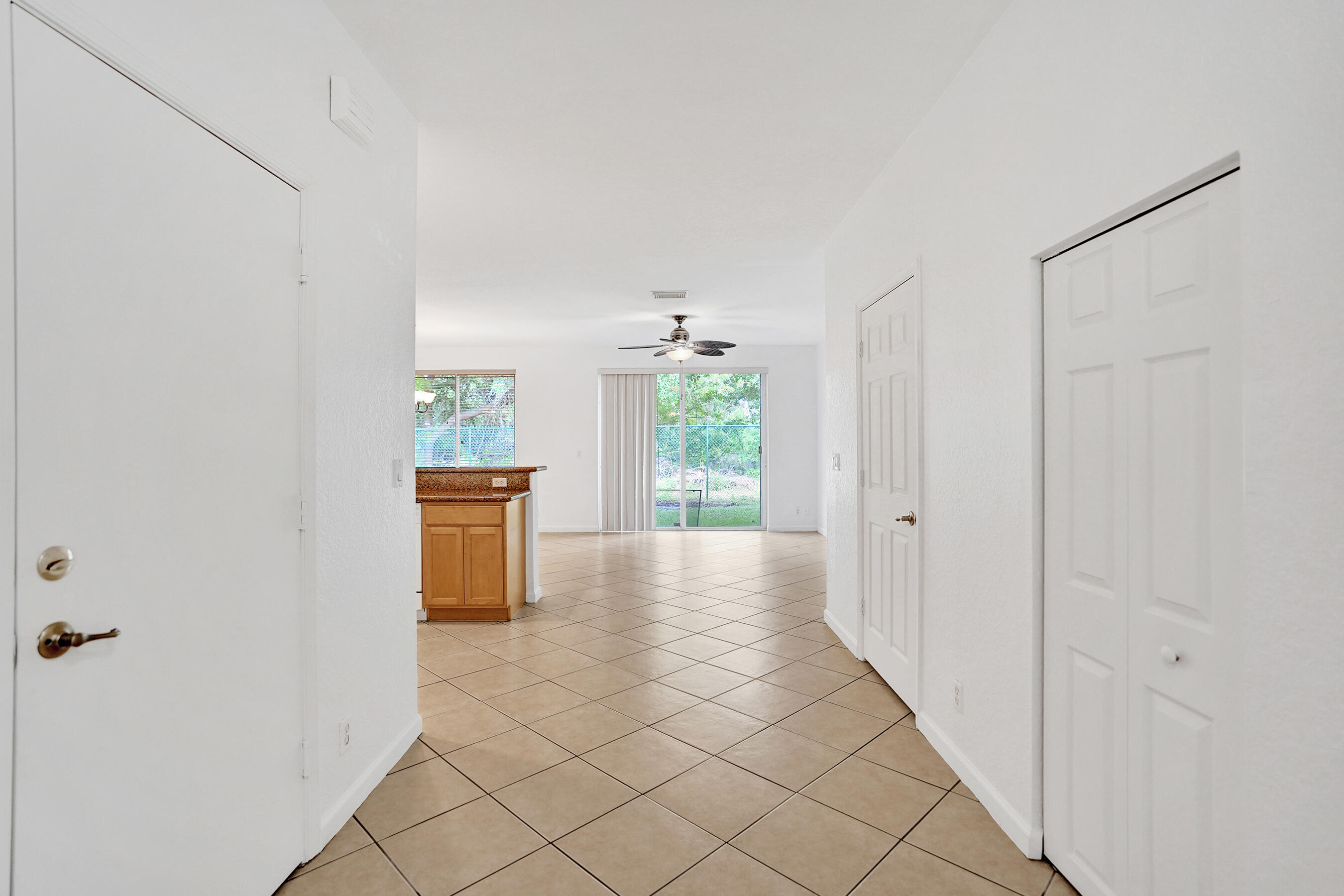 3072 North Evergreen Circle Boynton Beach, FL 33426 - Photo 6 of 55 a view of a hallway with furniture and a window