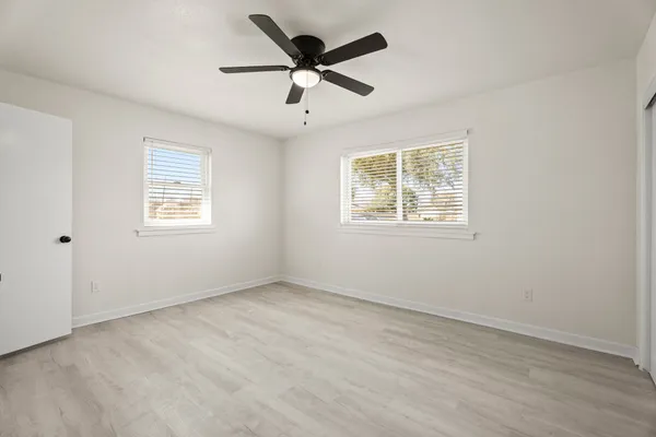 a view of an empty room with a window