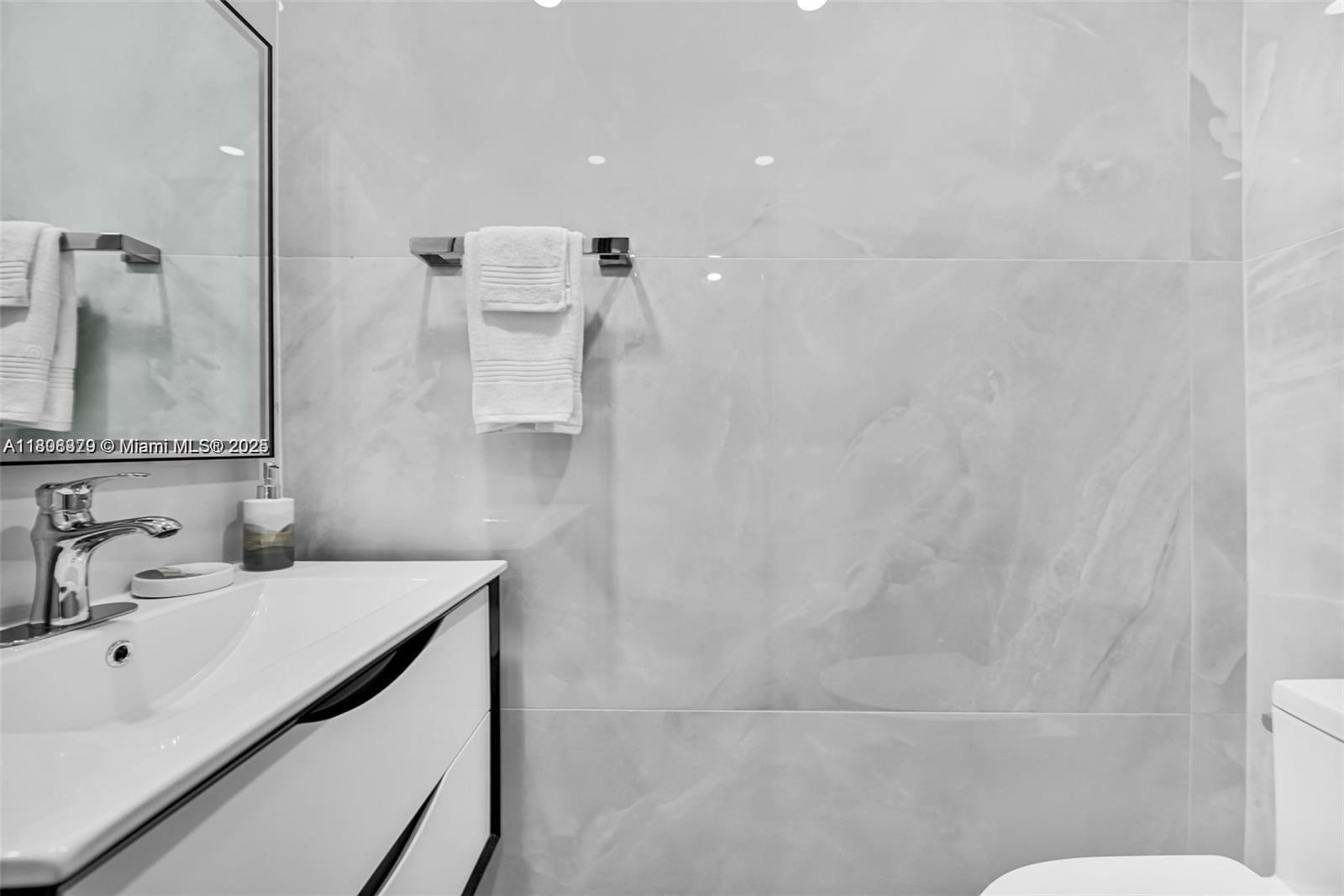 7335 Southwest 104th Street Pinecrest, FL 33156 - Photo 11 of 36 a bathroom with a sink a toilet and shower