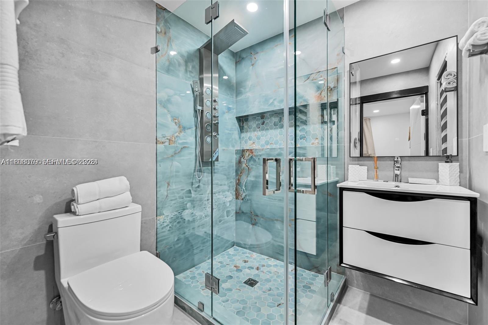 7335 Southwest 104th Street Pinecrest, FL 33156 - Photo 16 of 36 a bathroom with a sink a toilet and shower