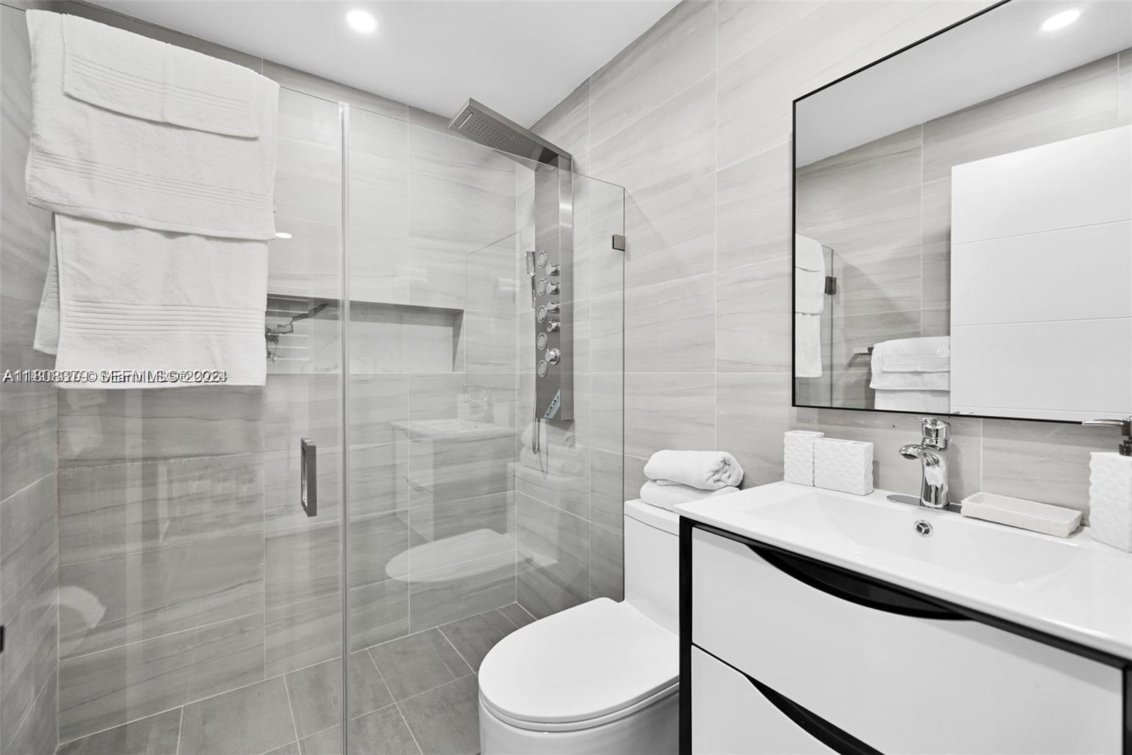 7335 Southwest 104th Street Pinecrest, FL 33156 - Photo 20 of 36 a bathroom with a sink toilet and shower