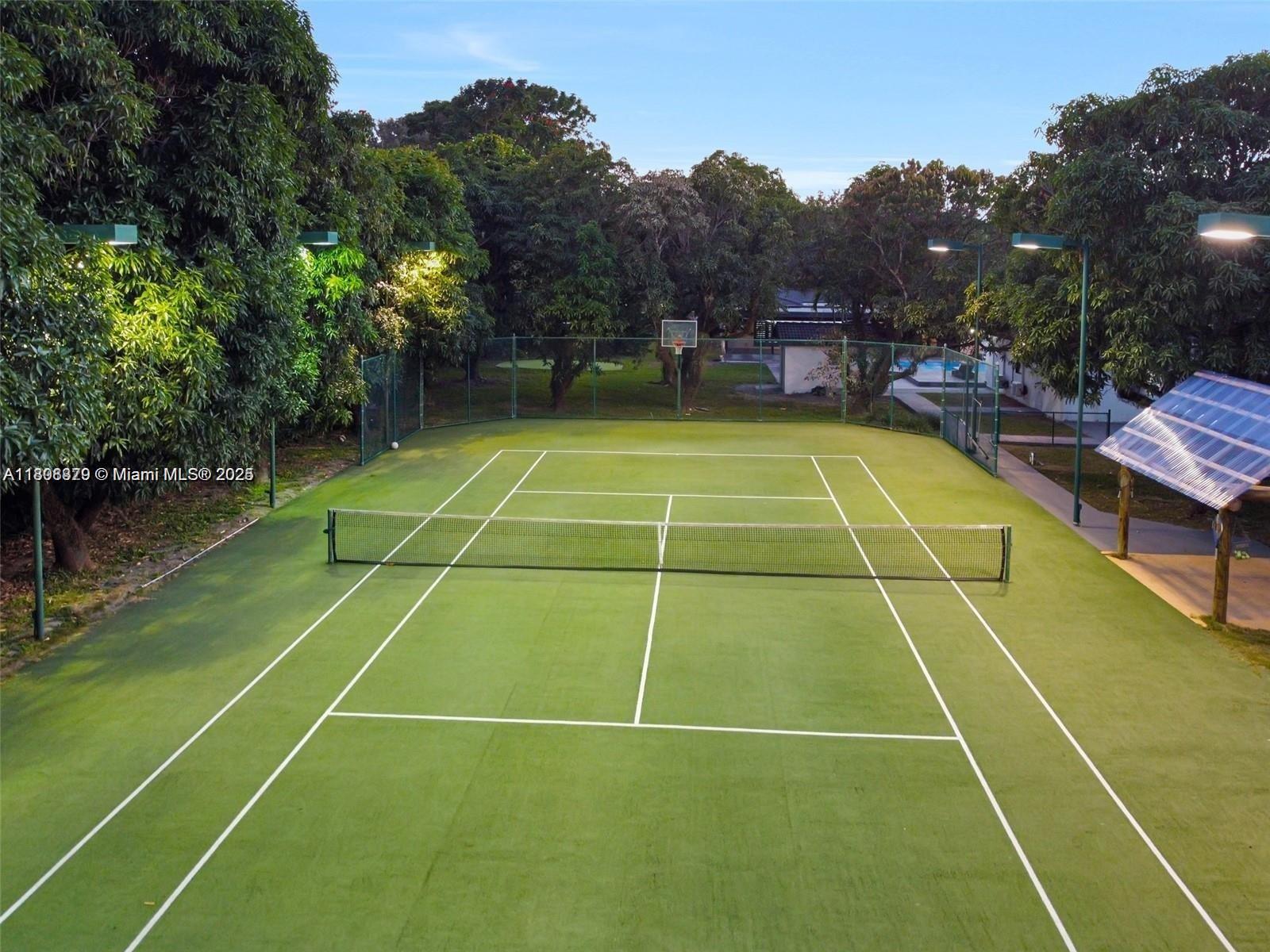 7335 Southwest 104th Street Pinecrest, FL 33156 - Photo 24 of 36 a view of a tennis court