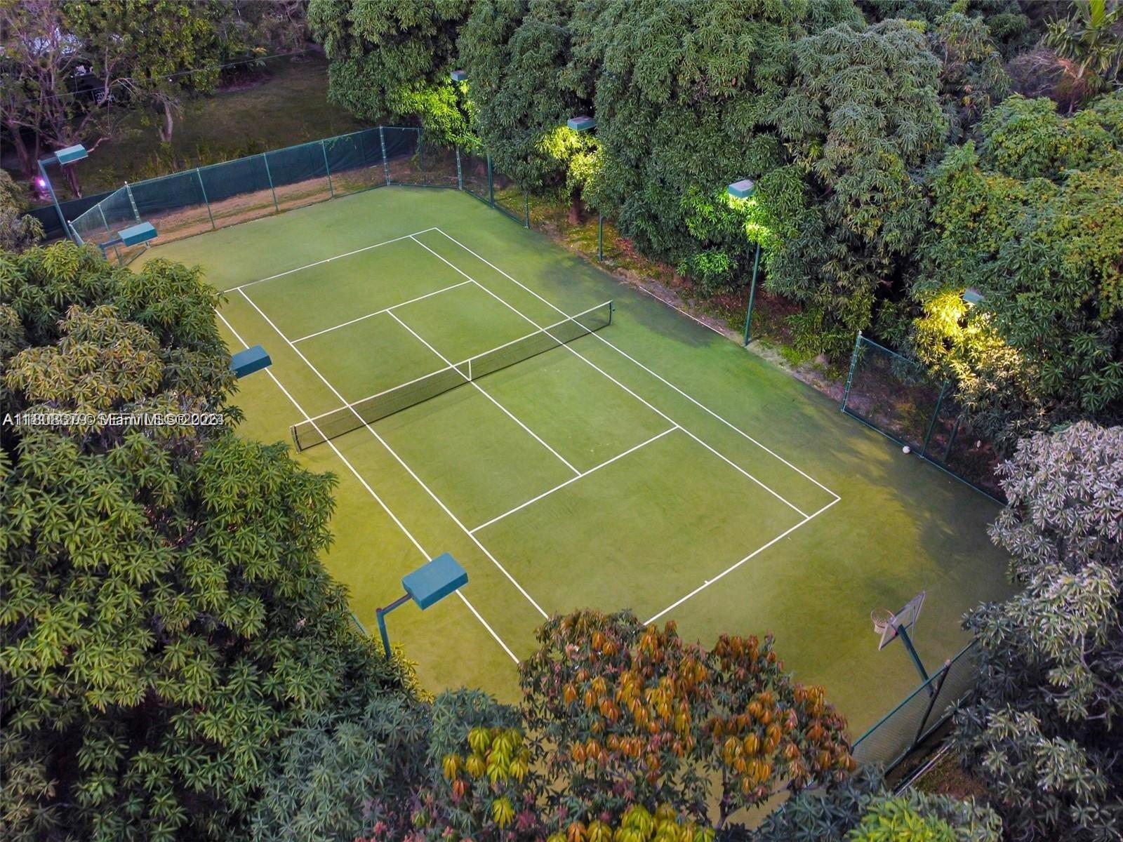7335 Southwest 104th Street Pinecrest, FL 33156 - Photo 25 of 36 a view of a tennis court