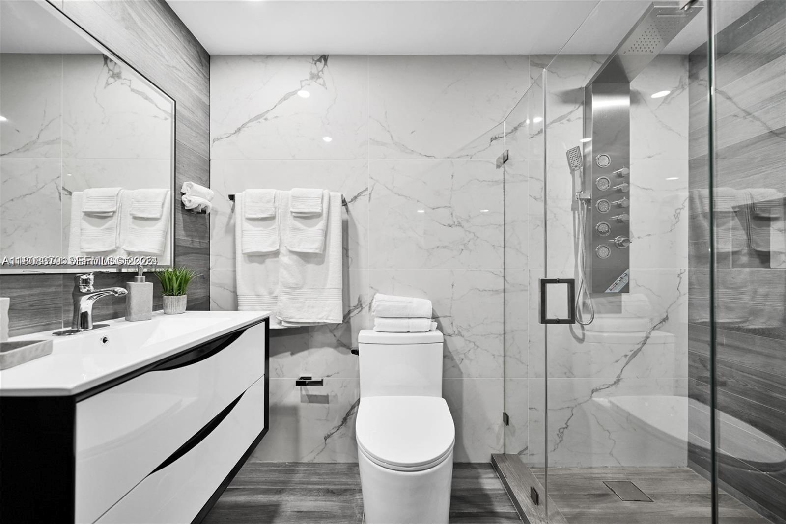 7335 Southwest 104th Street Pinecrest, FL 33156 - Photo 29 of 36 a bathroom with a sink toilet and shower