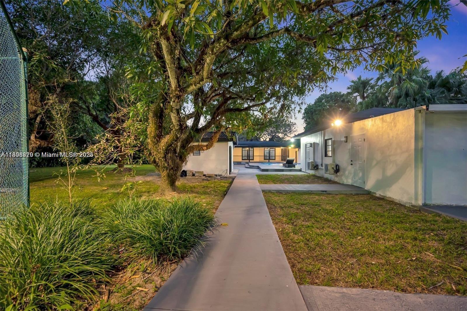 7335 Southwest 104th Street Pinecrest, FL 33156 - Photo 36 of 36 a view of swimming pool with a patio