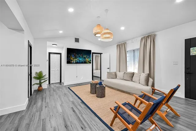 a living room with furniture and a table