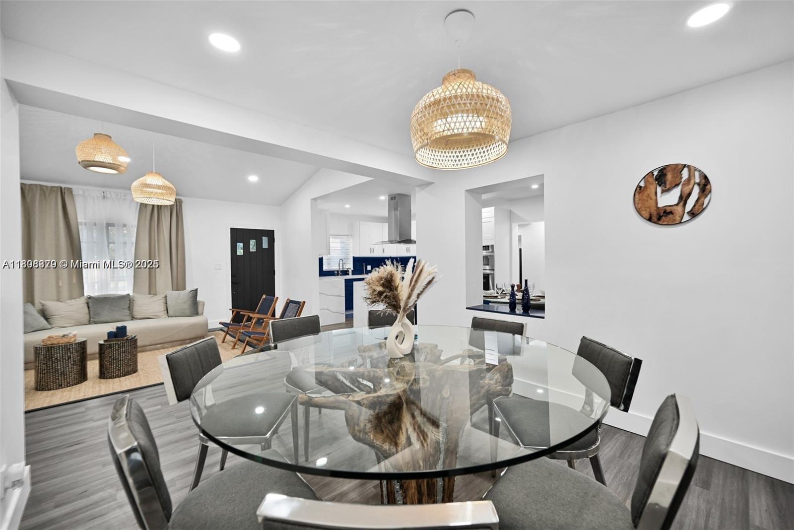 7335 Southwest 104th Street Pinecrest, FL 33156 - Photo 7 of 36 a view of a dining room with furniture