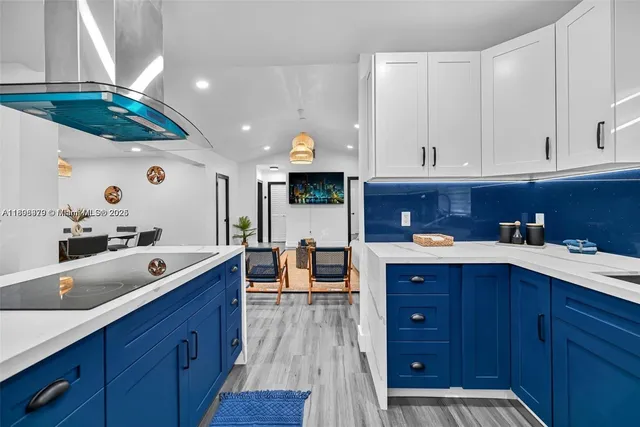 a kitchen with a sink and wooden cabinets