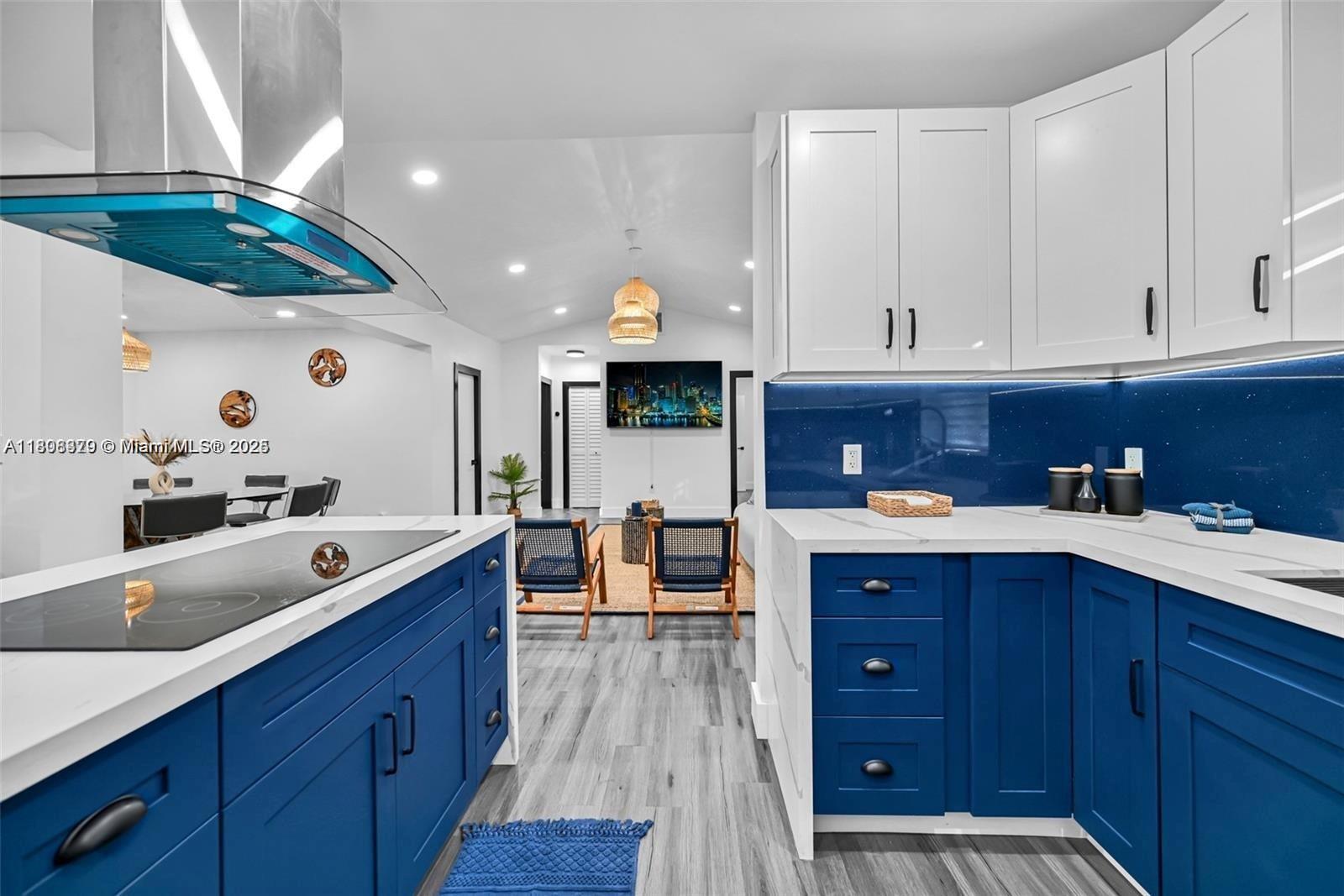 7335 Southwest 104th Street Pinecrest, FL 33156 - Photo 8 of 36 a kitchen with a sink and wooden cabinets