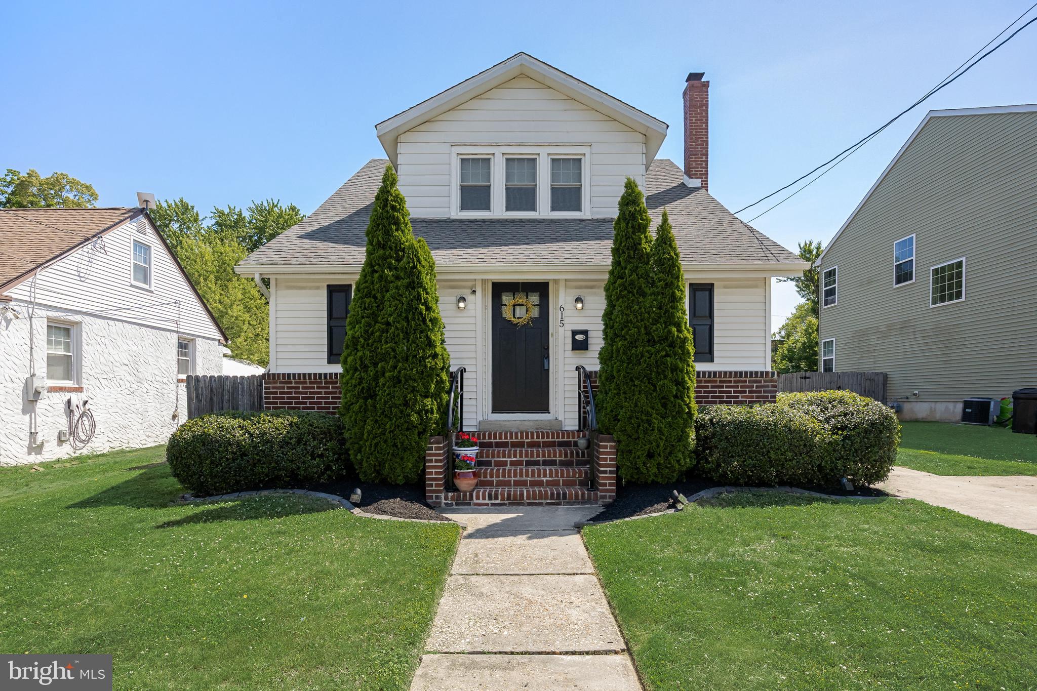 615 North Walnut Avenue Magnolia, NJ 08049 - Photo 1 of 40 a front view of a house with a yard