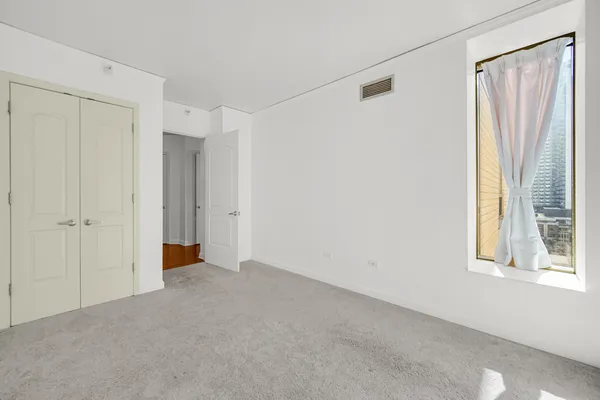 an empty room with an entryway door