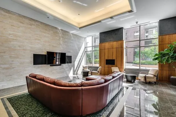 a room with pool table and windows
