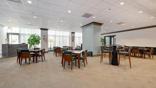 a group of people sitting in a living room