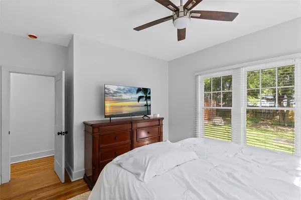 a bedroom with a bed and a dresser