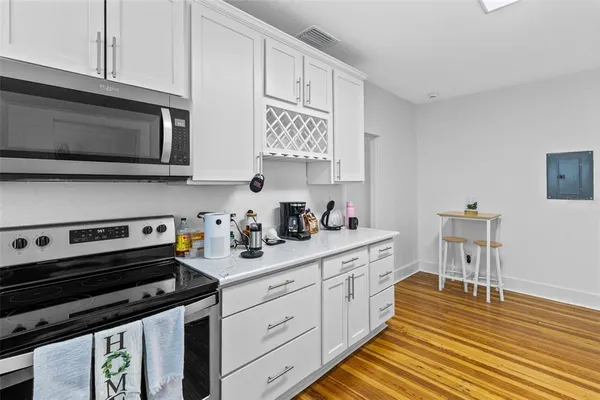 a kitchen with a stove and a microwave
