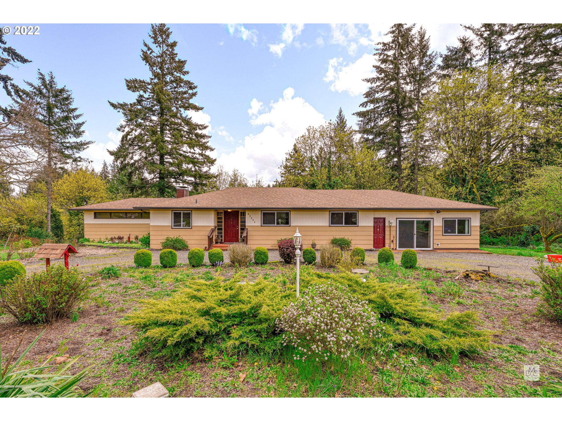 22496 South Bartholomew Road Estacada, OR 97023 - Photo 2 of 32 a house view with a garden space