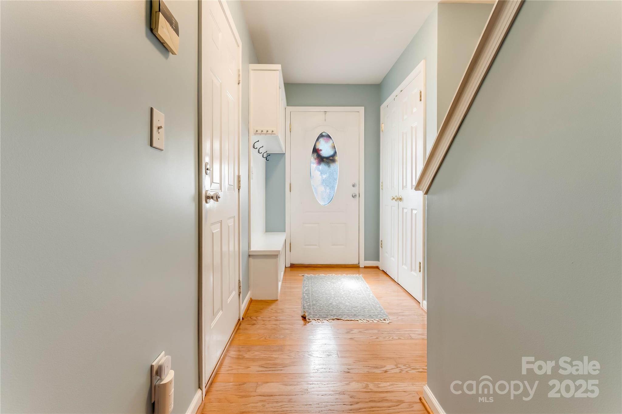 308 Rock Ridge Lane Mount Holly, NC 28120 - Photo 13 of 36 a view of a hallway with wooden floor and staircase