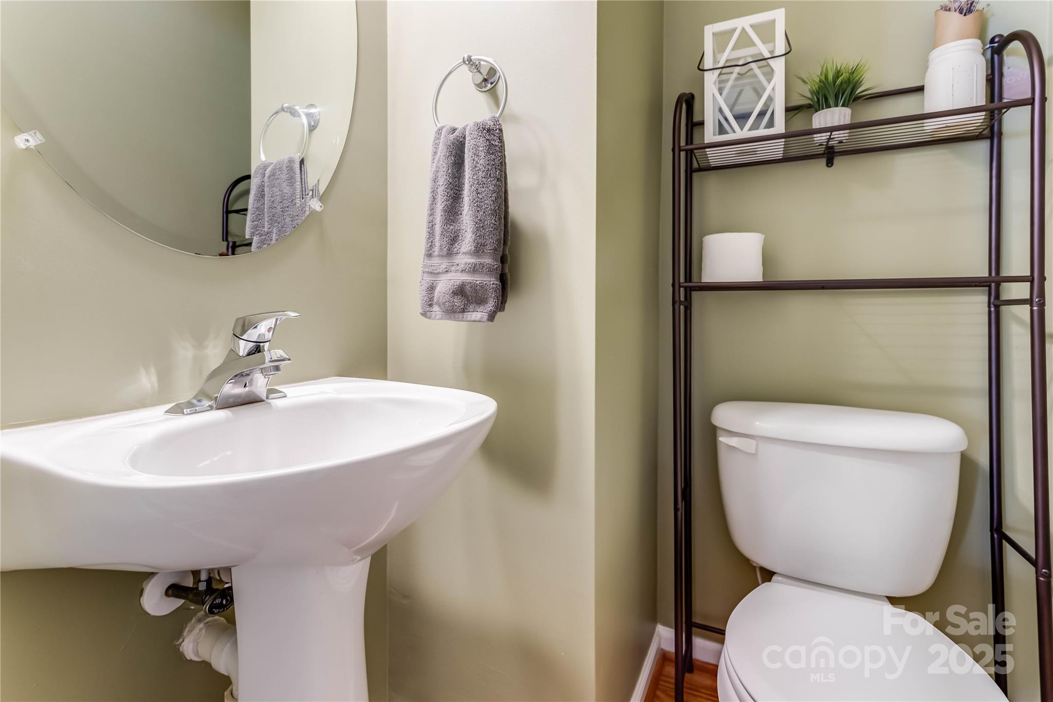 308 Rock Ridge Lane Mount Holly, NC 28120 - Photo 17 of 36 a bathroom with a toilet sink and mirror