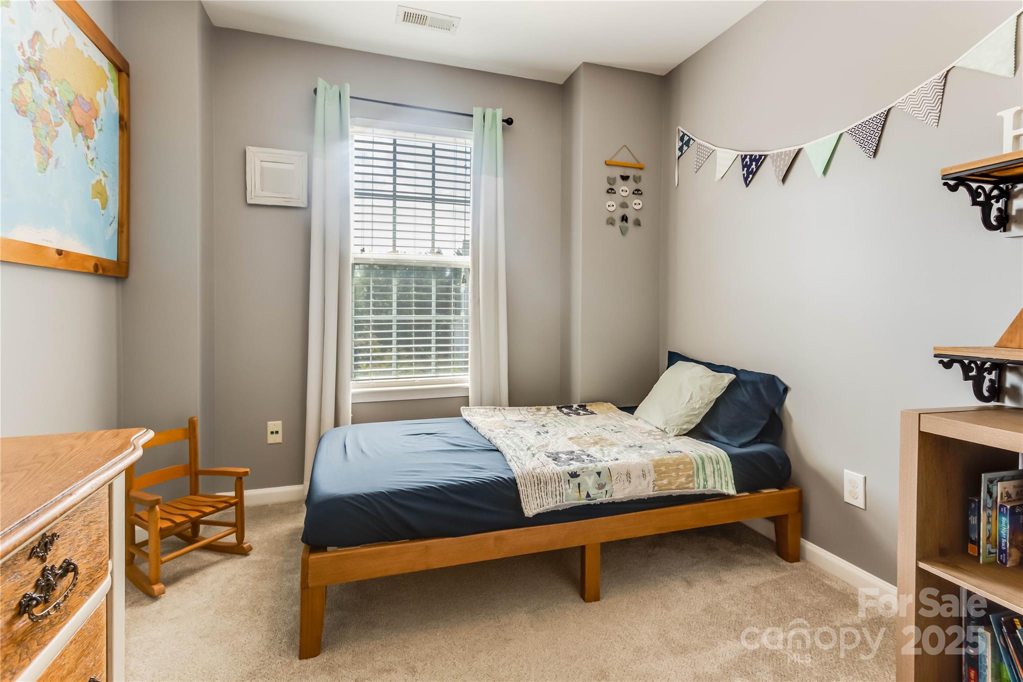 308 Rock Ridge Lane Mount Holly, NC 28120 - Photo 25 of 36 a bedroom with a bed and a window