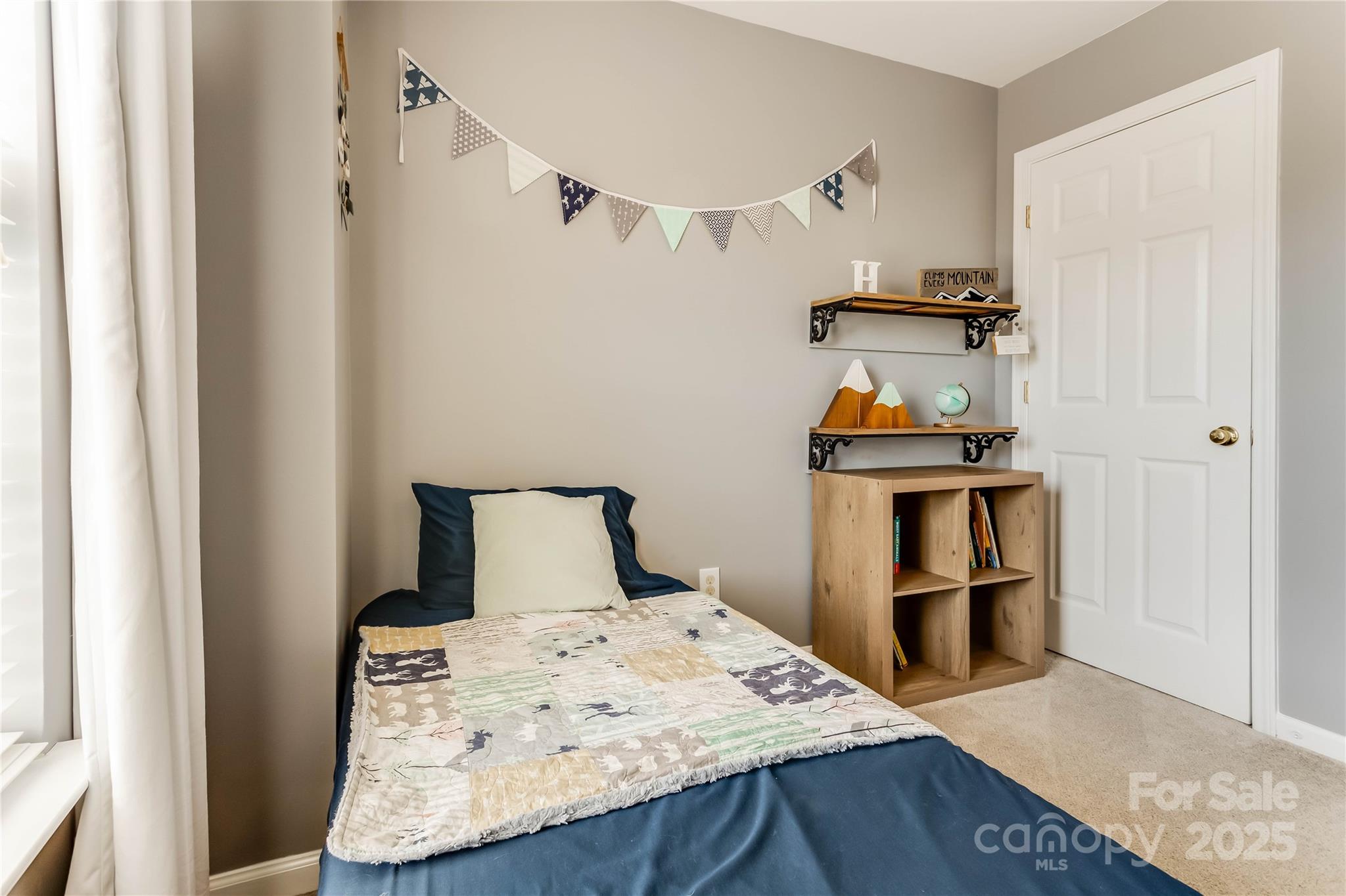 308 Rock Ridge Lane Mount Holly, NC 28120 - Photo 26 of 36 a bedroom with a bed and a table in it