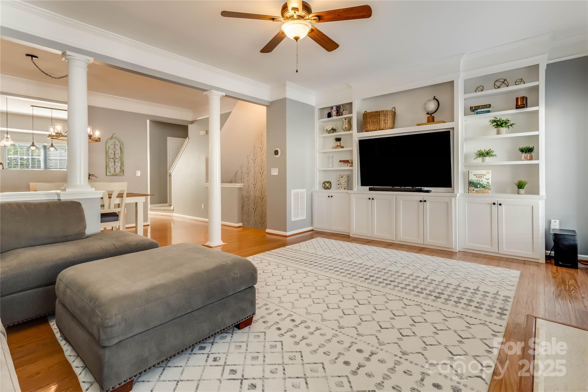 308 Rock Ridge Lane Mount Holly, NC 28120 - Photo 3 of 36 a living room with a flat screen tv and a fireplace