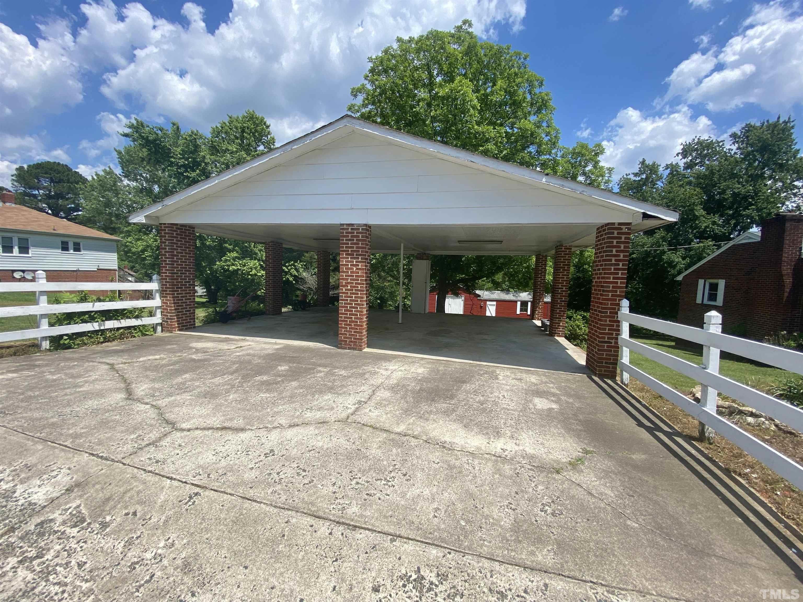 302 Allgood Street Roxboro, NC 27573 - Photo 27 of 30 a view of a house with backyard and porch