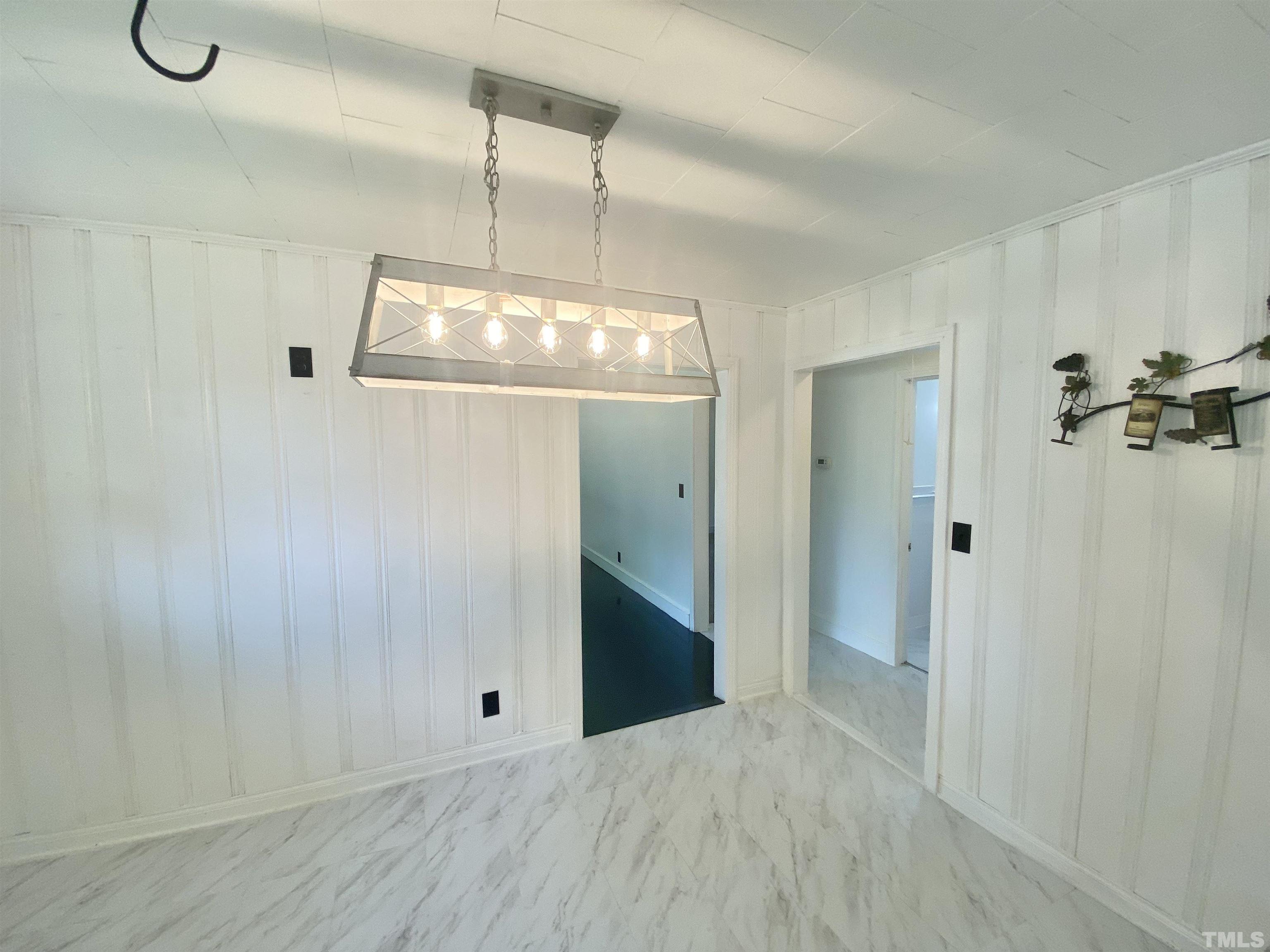 302 Allgood Street Roxboro, NC 27573 - Photo 8 of 30 a view of a chandelier fan and entryway