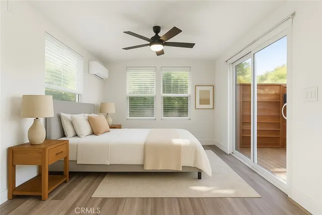 a bedroom with a large bed and a large window