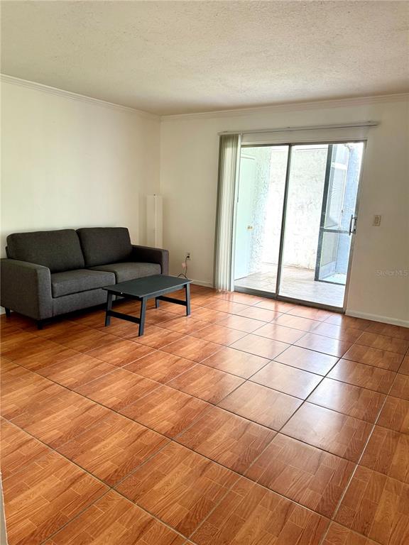 13300 Walsingham Road, Unit 161 Largo, FL 33774 - Photo 2 of 21 a living room with a black white checkered floor