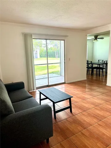 a kitchen with a refrigerator sink and cabinets