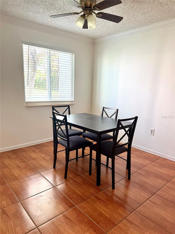 13300 Walsingham Road, Unit 161 Largo, FL 33774 - Photo 7 of 21 a view of a dining room with furniture and a window