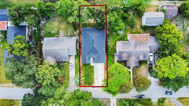 an aerial view of a house with a garden and plants
