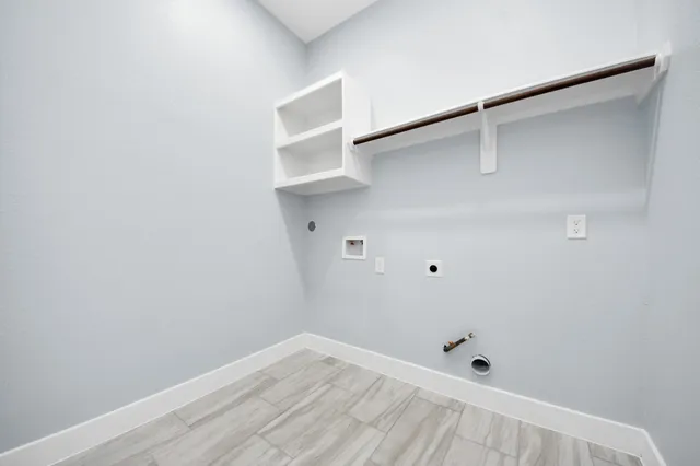 front view of a house with a potted plant