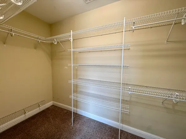 a view of an empty walk in closet