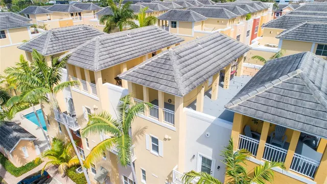 a front view of a residential apartment building with a yard