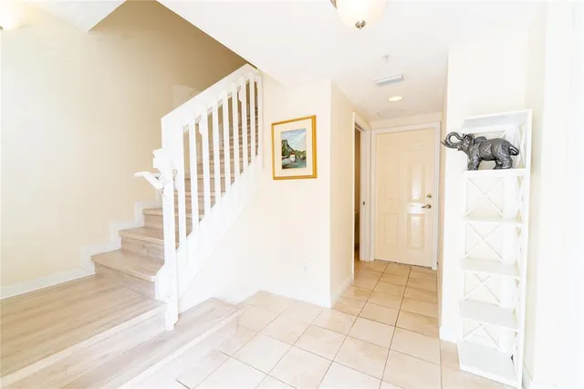 a view of a hallway view with staircase