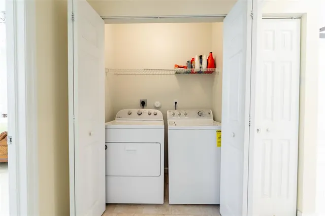 a utility room with dryer and washer